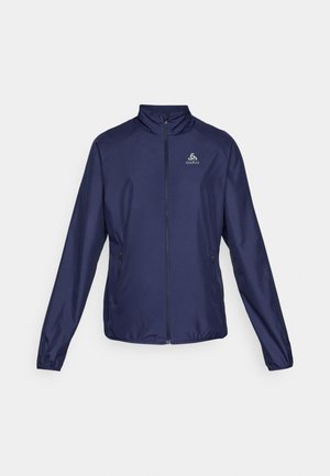 Navy blue lightweight jacket with a full front zipper, high collar, two side pockets, and logo on the chest. Smooth texture, athletic fit.