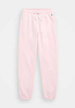 Light pink sweatpants with an elastic waist and drawstring, featuring side pockets and a small blue logo on the left hip. Soft fabric texture.