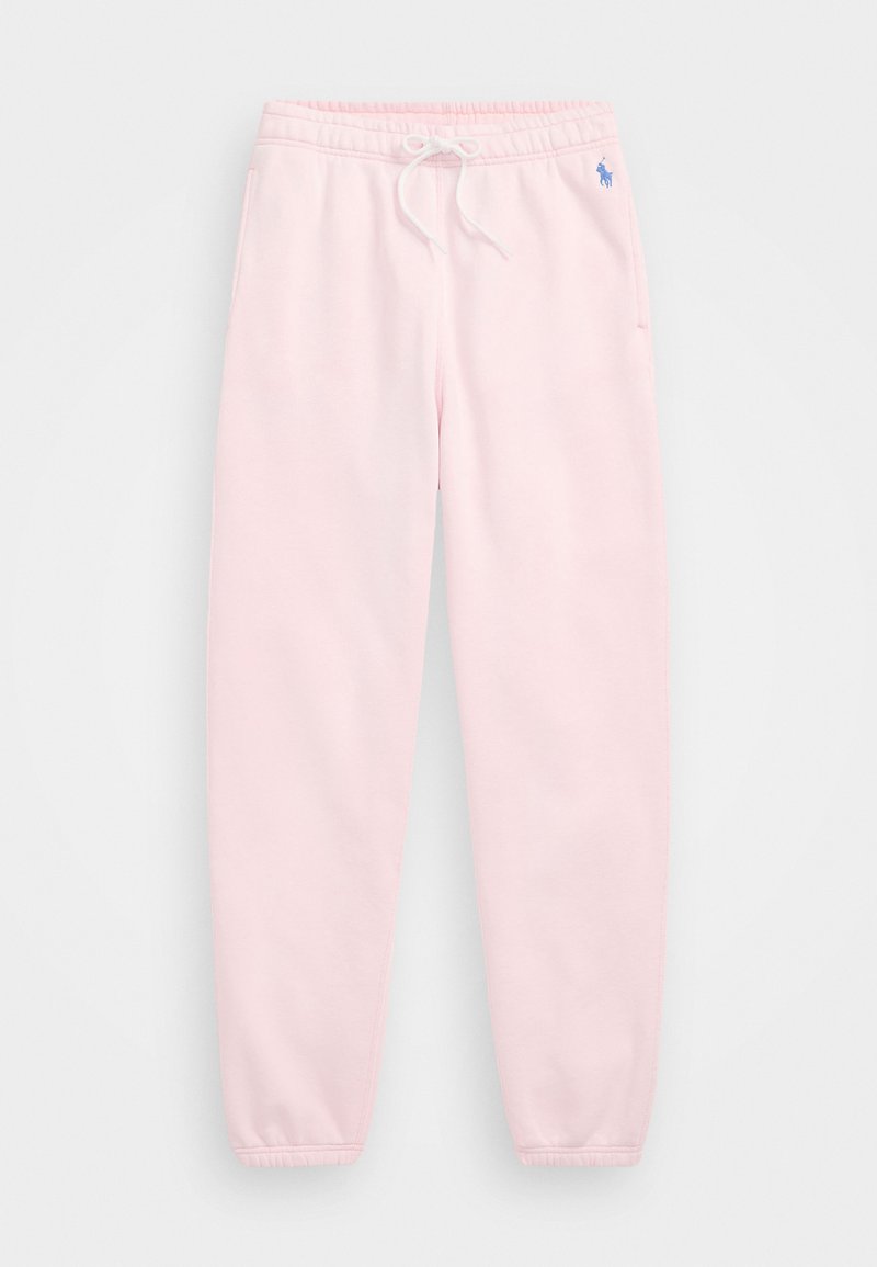 Gaiši rozā sporta bikses ar elastīgu jostu un auklu, ar sānu kabatām un mazu zilu logotipu kreisajā gurnā. Mīksta auduma tekstūra.