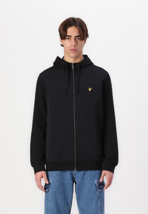Sudadera con cremallera negra y capucha ajustable, que presenta un pequeño logotipo amarillo en el pecho. Tejido suave, puños y dobladillo acanalados.
