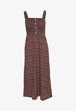 Robe noire à motifs floraux avec un corsage smocké, fines bretelles et boutons en bois sur le devant. Longueur midi avec une jupe fluide.