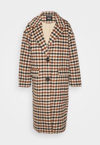 Langer, kariierter Mantel mit braunen, schwarzen und cremefarbenen Karos. Hergestellt aus einem strukturierten Stoff mit einem Reverskragen und zwei Fronttaschen. Zwei-Knopf-Verschluss.