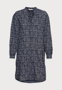 Robe à manches longues, marine, avec un motifPaisley en blanc. Présente un col sans col et une coupe décontractée avec un ourlet arrondi.