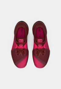 Pair of maroon and bright pink athletic shoes with laces, shown from above on a white background.