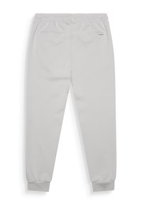 Pantalons de survêtement gris clair en matériau doux, avec une taille élastique, des chevilles resserrées et deux poches arrière.