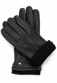 Schwarze Lederhandschuhe mit einem gerippten schwarzen Strickbund, der drei genähte Linien auf der Rückseite und einen kleinen metallischen Akzent aufweist.