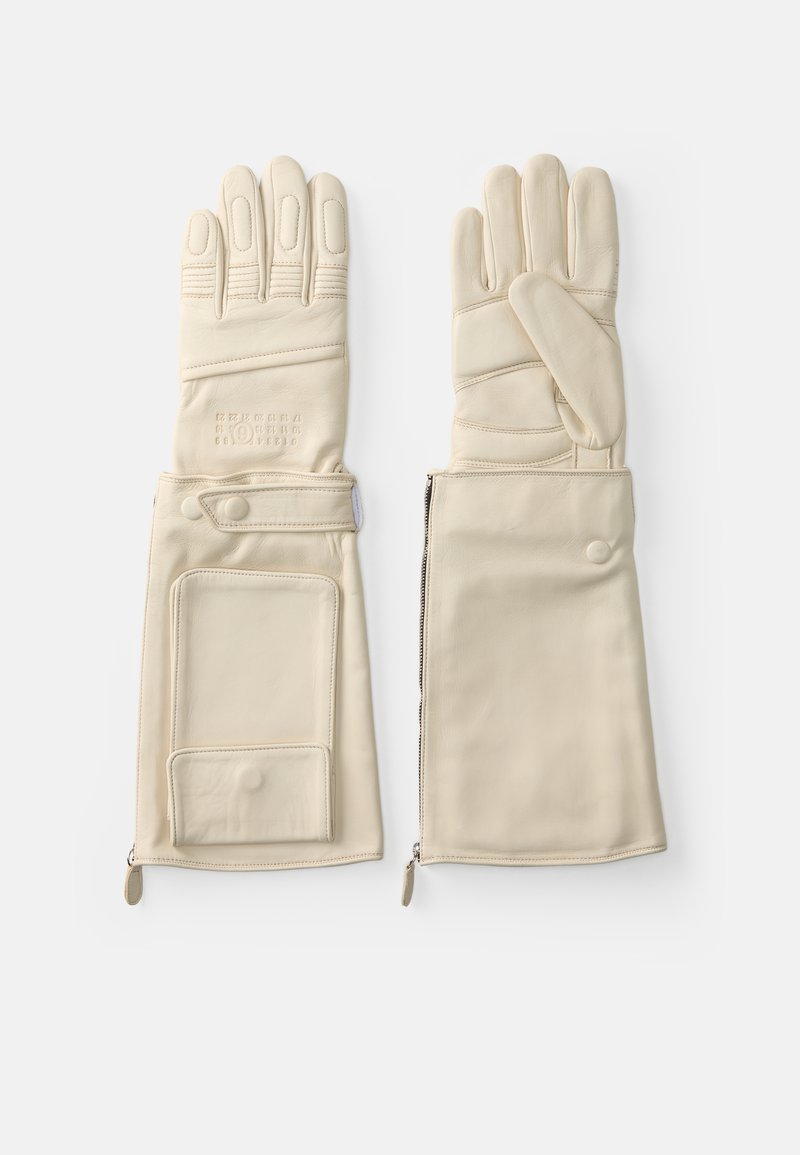 Kremo spalvos odiniai pirštinės su pirštų sekcijomis, užtrauktuku ir kišenėle ant vienos pirštinės. Lygus paviršius su siūlėmis.