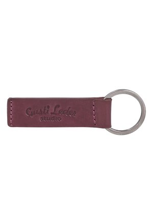 Dark red leather keychain with silver metal ring and embossed "Gusti Leder studio" logo.