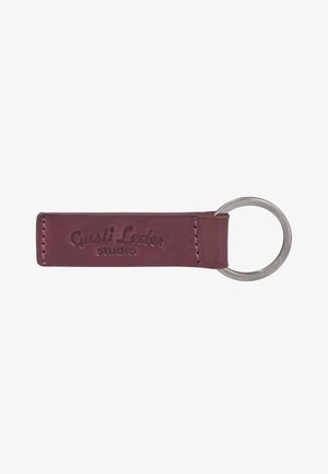 Dark red leather keychain with silver metal ring and embossed "Gusti Leder studio" logo.