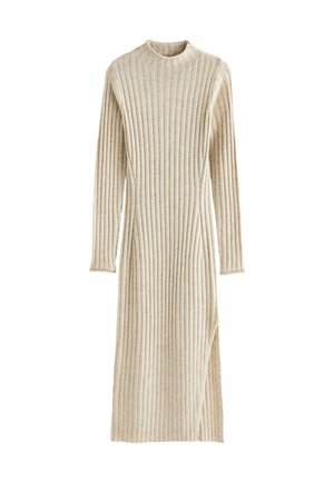 Beige ribbed knit dress with long sleeves, high neckline, and side slit. Soft texture with vertical stripes, knee-length design.