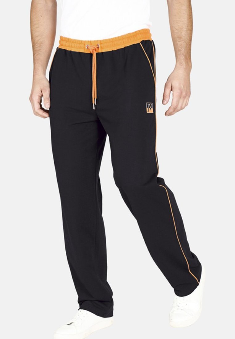 Schwarze Jogginghose mit elastischem Taillenbund und orangefarbene Kordel. Mit orangefarbenen seitlichen Einsätzen und einem Logo in Hüfthöhe.