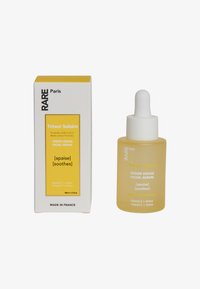 Rare Paris TRÉSOR SOLAIRE FACE SERUM - Serum - yellow