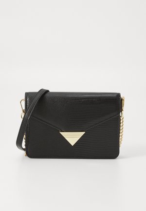 Black faux leather handbag with a textured finish, gold triangular accent, chain strap, and a flap closure. Compact rectangular shape.