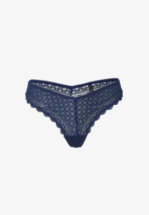 String in pizzo blu navy con motivo a diamante, bordi scallop e un piccolo fiocco decorativo al centro davanti.