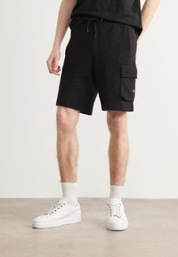 Calvin Klein Jeans - LABEL - Tracksuit bottoms - black Thumbnail Image 1