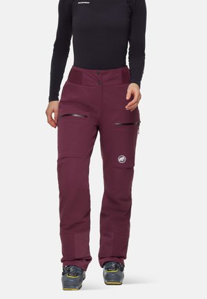 Bordeaux ski broeken met een gladde textuur, voorzien van twee met rits afgesloten zakken en een geborduurd logo. Tapered fit met een verstevigde onderzoom.