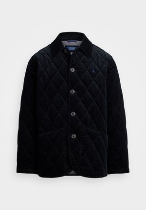 Veste en velours côtelé noir matelassé avec un col, fermeture à boutons sur le devant et deux poches avant. Logo discret sur la poitrine.