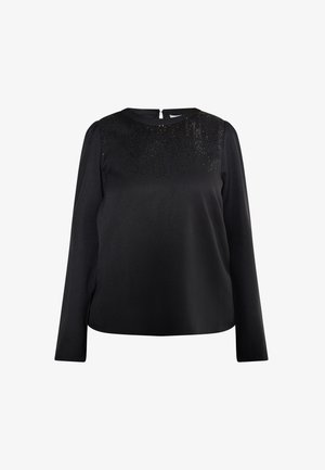 Blusa negra de mangas largas con un patrón de lentejuelas texturizadas en la parte superior delantera, escote redondo y cierre de cremallera en la espalda. Tejido suave.
