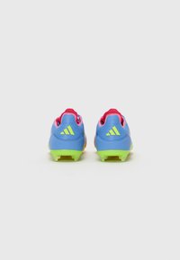 Blue and pink soccer cleats with green soles. Breathable mesh upper, padded collar, and distinctive three-stripe logo on the heel.