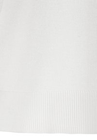 White knitted sweater with a ribbed hem. The texture appears smooth with a fine gauge knit, creating a lightweight and breathable feel.