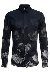 Chemise à manches longues en tissu bleu foncé, présentant un motif floral délavé en tons gris, col boutonné et fermeture à boutons sur le devant.