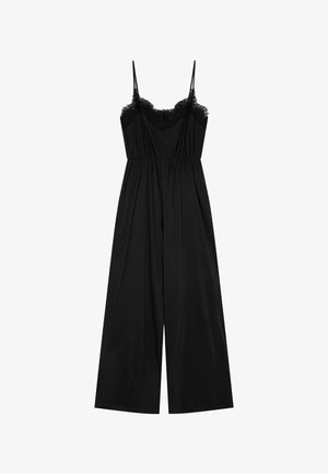 Black jumpsuit with lace trim along the bust, adjustable spaghetti straps, and a wide-leg design. Made of lightweight fabric, features pleating detail.