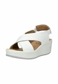 Sandale compensée blanche avec brides croisées, bout ouvert, semelle intérieure rembourrée couleur fauve et bride arrière en velcro sur une semelle rainurée.