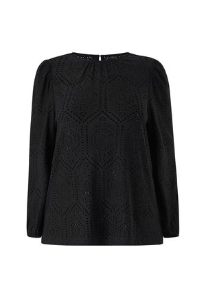 Zwarte blouse met lange mouwen en een gestructureerd patroon van uitsparingen in een hexagonaal ontwerp. Rond de hals met een kleine sluiting aan de achterkant.