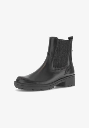 Black leather ankle boot with stretchy textured fabric panels, a rounded toe, and a chunky rubber sole. Features a pull tab for easy wear.