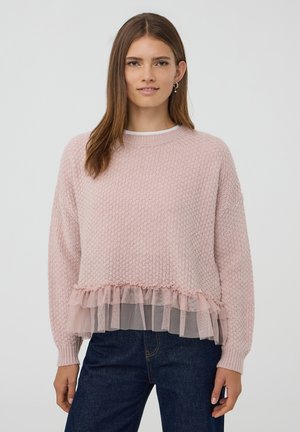 Maglione rosa chiaro in tessuto a maglia testurizzata, con orlo in tulle arricciato. Collo rotondo e maniche lunghe. Fit casual con spalle leggermente scese.