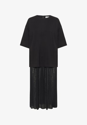 Black layered dress with short sleeves; top is solid fabric, bottom is sheer and flowing. Features a round neckline and back zipper.