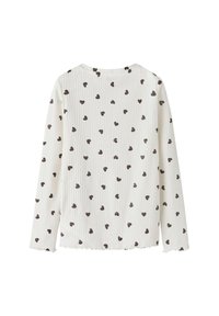 Valge ribatud pika varrukaga pluus mustade südame mustritega, ümmargune kaelus ja salatiäärtega servad varruka- ja alaosas.