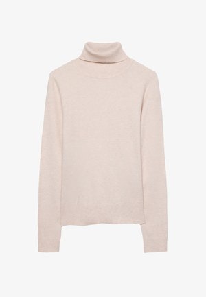 Beige ribstrikket rullekravetrøje båret af person med lyst blondt hår synligt på højre side.