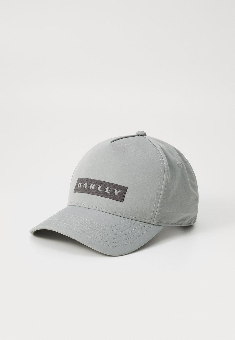 Gray baseball cap made of lightweight fabric, featuring a black rectangular patch with "OAKLEY" in bold white letters.