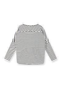 Camiseta de manga larga a rayas con rayas horizontales en blanco y negro, cuello redondo y un ajuste relajado con un dobladillo recto.