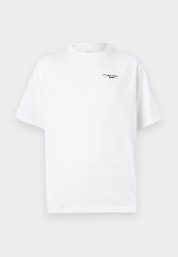 White cotton t-shirt with a crew neckline and short sleeves. Features a black "Calvin Klein Jeans" logo on the upper left chest.