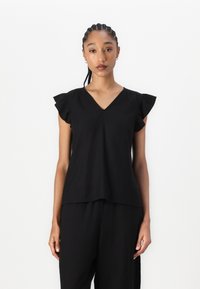 Top corto nero a maniche corte con spalle arricciate, design a V e vestibilità rilassata. Realizzato in tessuto leggero, con una texture liscia.