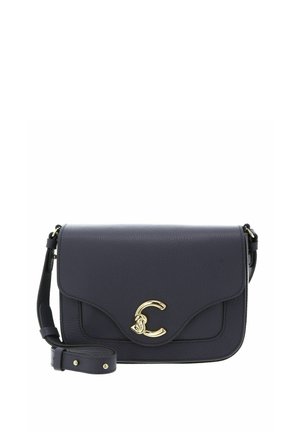 Black leather crossbody bag with gold clasp shaped like a stylized letter C and adjustable strap looped in front.