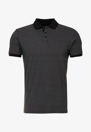 Black polo shirt with a white zigzag pattern, featuring a black collar and short sleeves. Made of a smooth fabric with a tailored fit.