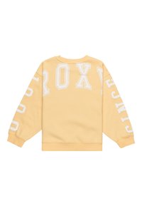 Sudadera amarilla con puños y dobladillo acanalados. "ROXY" y "DESDE" impresos en letras grandes blancas en la parte posterior y la manga. Textura de tela suave.