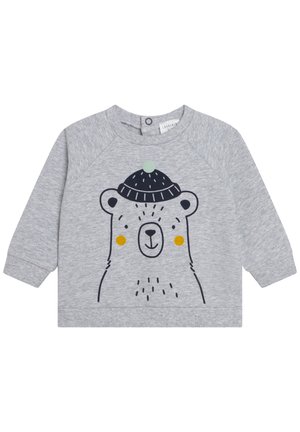 Pull bébé à manches longues gris clair avec un visage d'ours noir simple portant un bonnet bleu foncé tricoté avec un pompon vert et des joues jaunes.