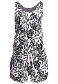 Une combinaison sans manches noir et blanc avec un motif de feuilles, dotée d'un col rond et d'une taille élastique avec cordon de serrage.