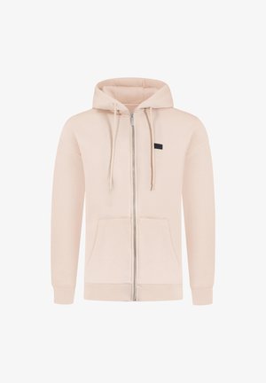Sudadera con cremallera de color rosa claro, con capucha ajustable mediante cordón, bolsillos frontales, puños de canalé y un pequeño detalle de etiqueta negra. Textura de tela suave y lisa.