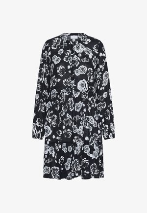 Czarna sukienka z białymi wzorami róż, długimi rękawami, okrągłym dekoltem oraz warstwowym krojem w luźnym fasonie.