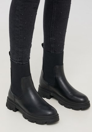 Stivaletti con plateau - nero