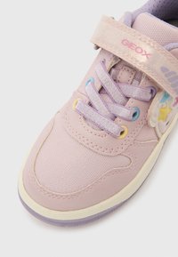 Light purple kids' sneaker with glittery strap, lavender laces, pastel eyelets, star decorations, and off-white sole on white background.