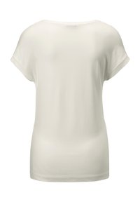 Witte T-shirt met korte mouwen en een soepele, zachte textuur. Beschikt over een ronde halslijn en een ontspannen pasvorm. Eenvoudig en minimalistisch ontwerp.