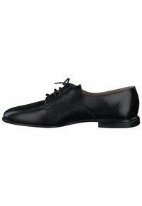 Scarpa da dress nera in pelle con una superficie liscia, design con lacci, punta arrotondata e suola piatta in gomma. Stile minimalista con dettagli di cucitura sottili.