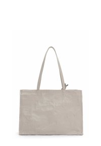 Beige kantokassi, jossa on sileä nahkamateriaali, suorakaiteen muotoinen, kaksi pitkää kahvaa ja hienovarainen rakenne. Varustettu ylhäältä suljettavalla vetoketjulla.