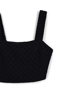 Top corto nero con spalline larghe arricciate e motivo in tessuto ad occhiello.